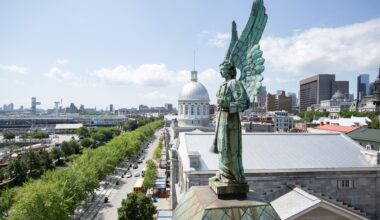 A copper angel statue that has turned green is seen on a rooftop overlooking Old Montreal.