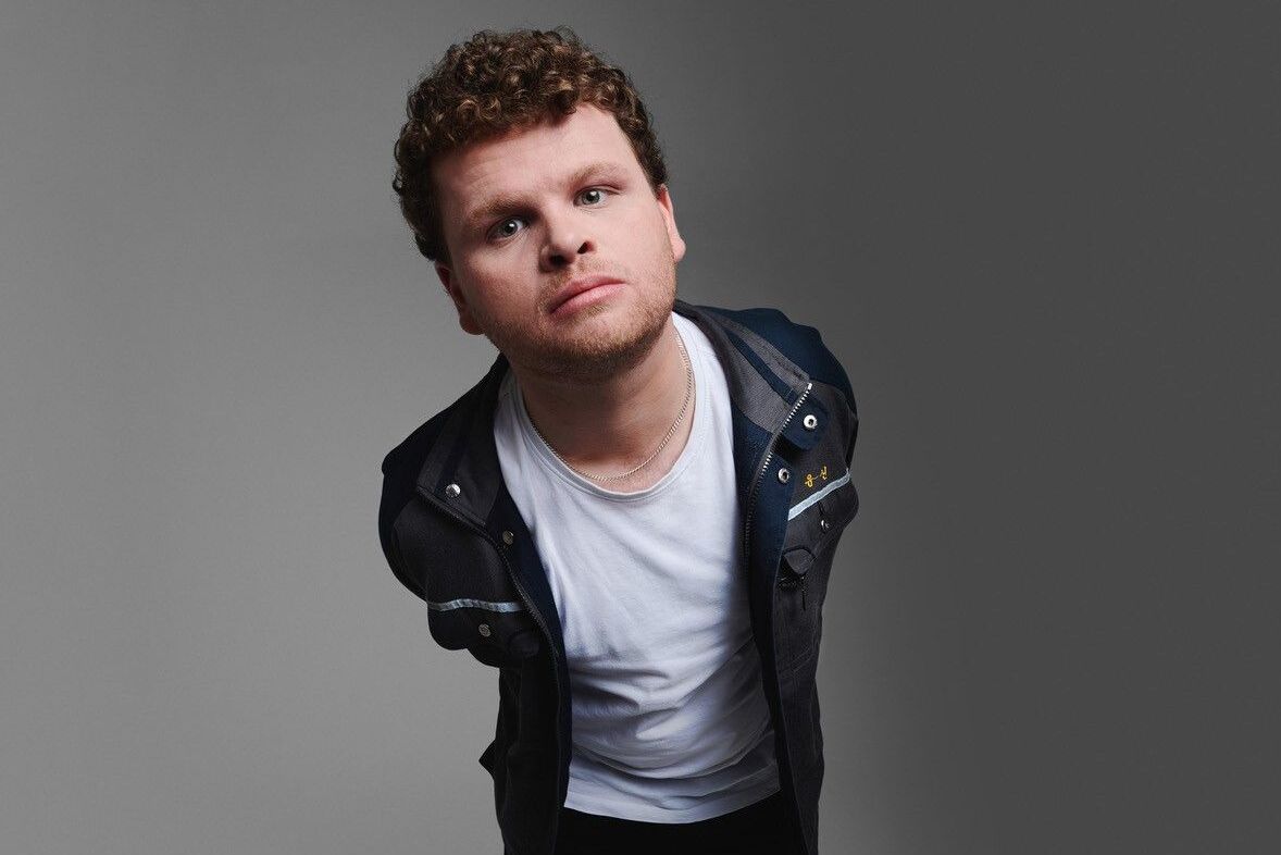 Dan Tiernan in white T-shirt and black leather jacket.