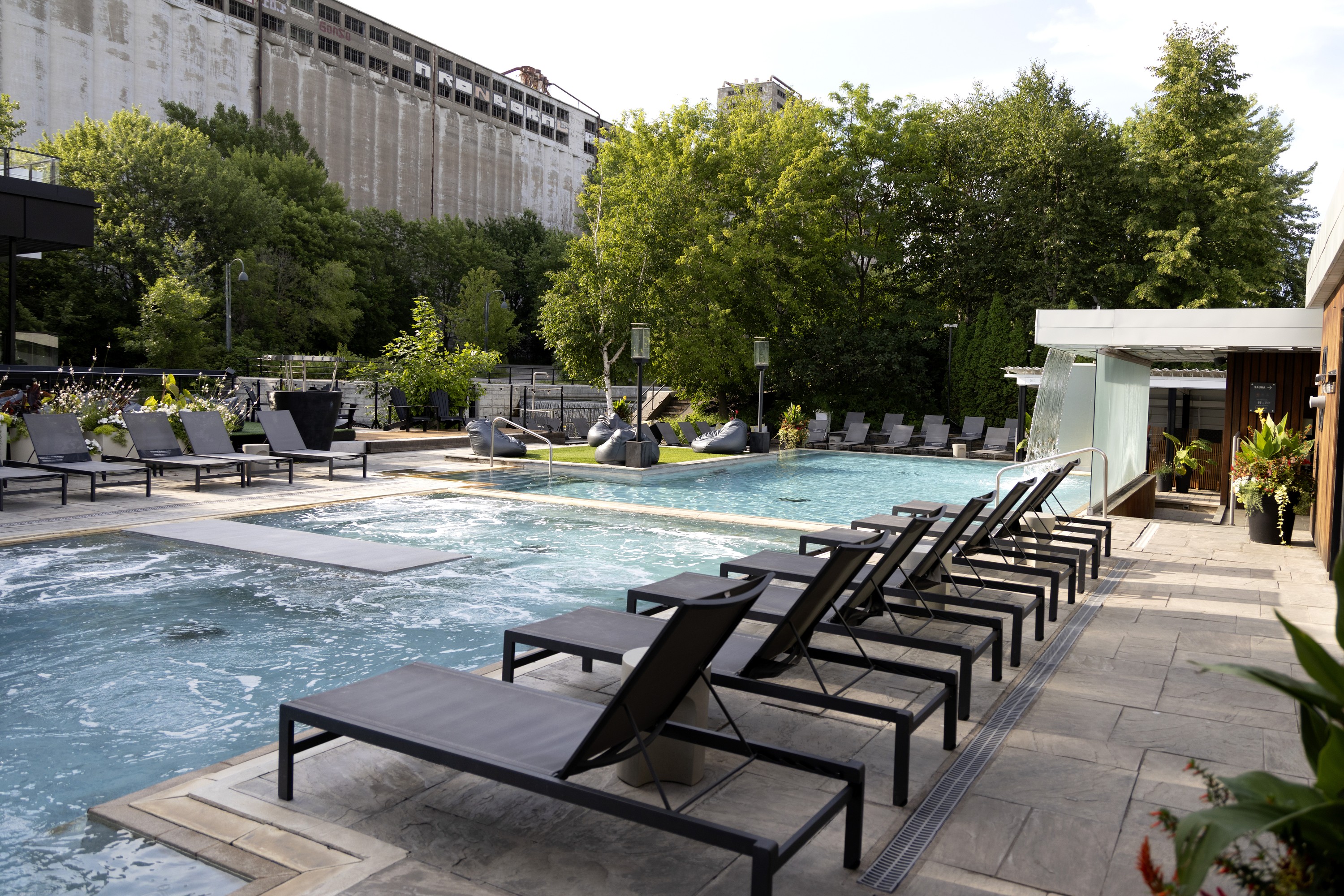 Outdoor pools with deck chairs.