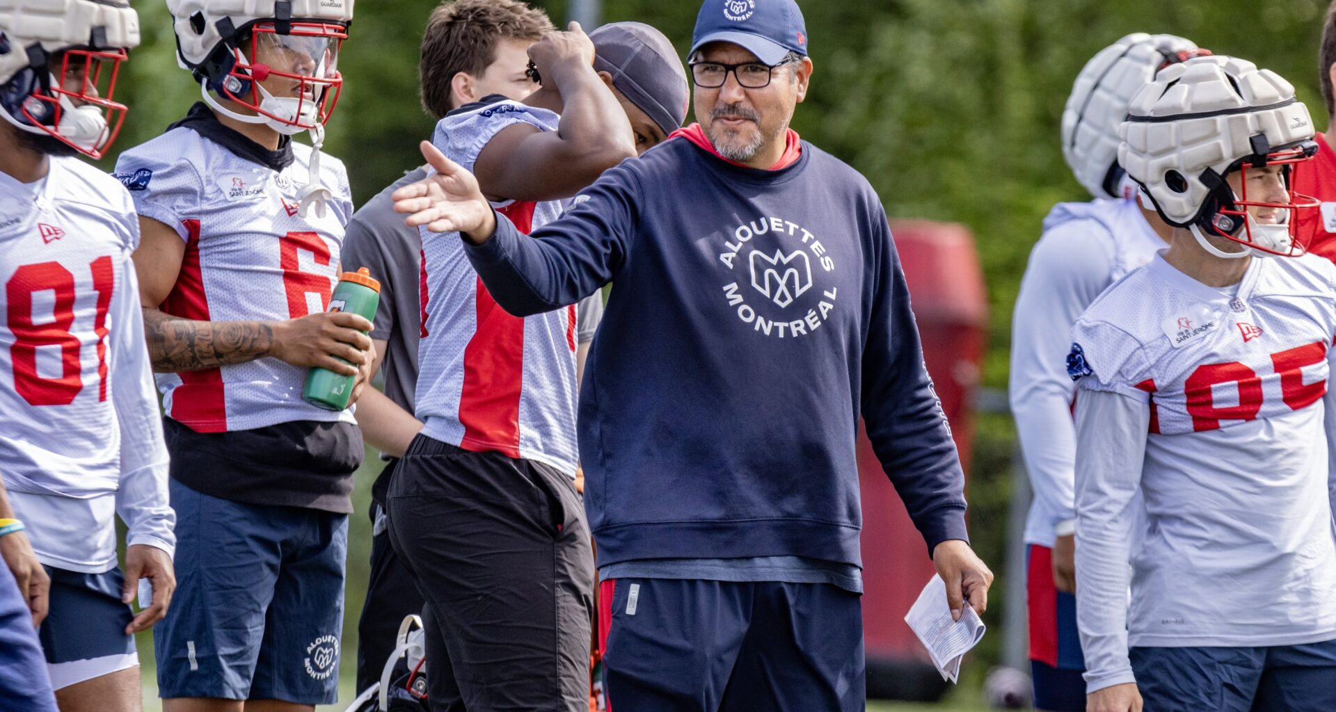 Offensive-co-ordinator Anthony Calvillo speaks to his players during training camp.