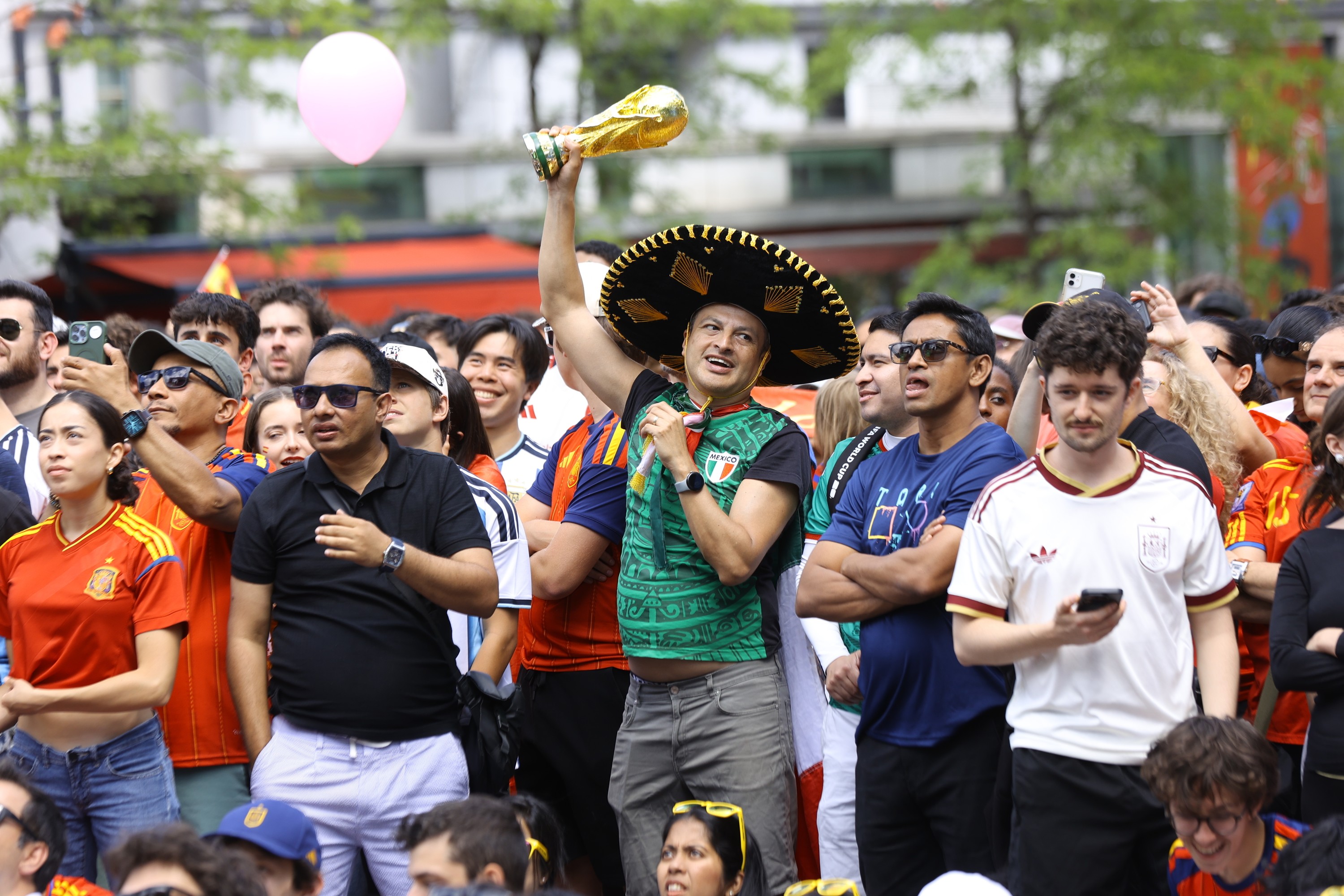 A Mexico fan remains in the FIFA World Cup spirit as fans watch an outdoor screening of the final between Spain and Argentina, at Place des Festivals in Montreal