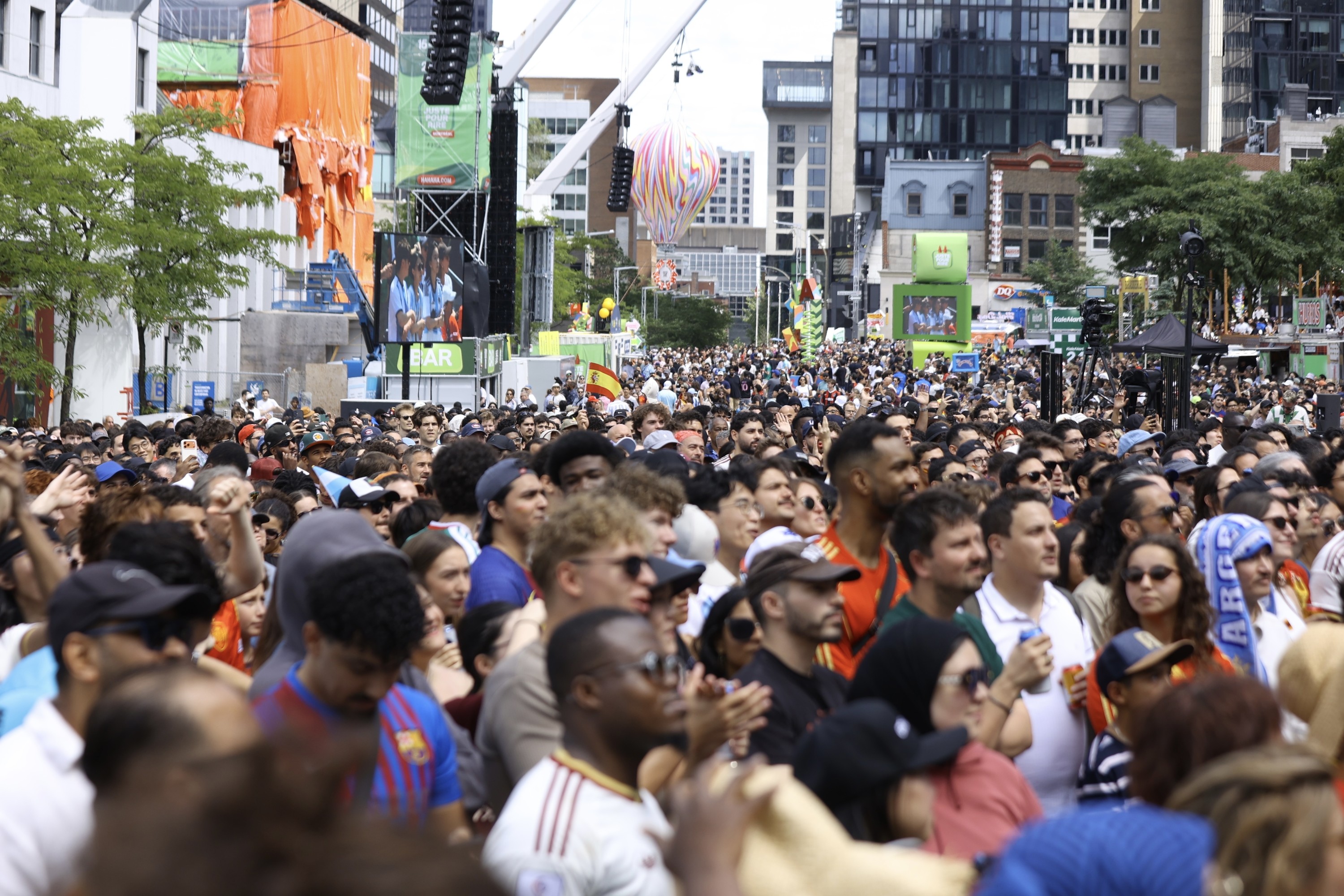 Fans watch an outdoor screening of the FIFA World Cup final between Spain and Argentina, at Place des Festivals in Montreal