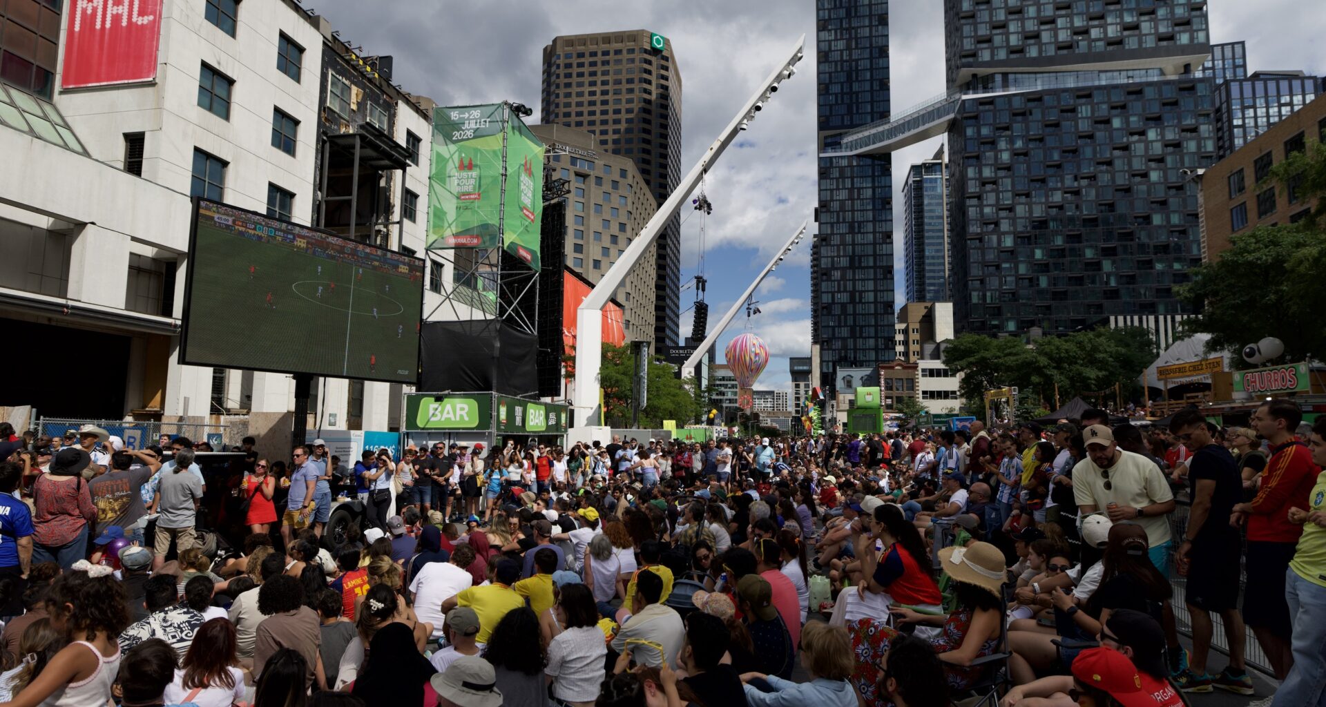 Fans watch an outdoor screening of the FIFA World Cup final between Spain and Argentina, at Place des Festivals in Montreal