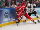 Aiden Celebrini of the Boston University Terriers battles Garrett Szydlowski of the Western Michigan University Broncos for the puck at Enterprise Center in St. Louis on April 12, 2025.