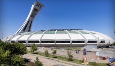 Montreal's Olympic Stadium is seen from the side on a sunny day