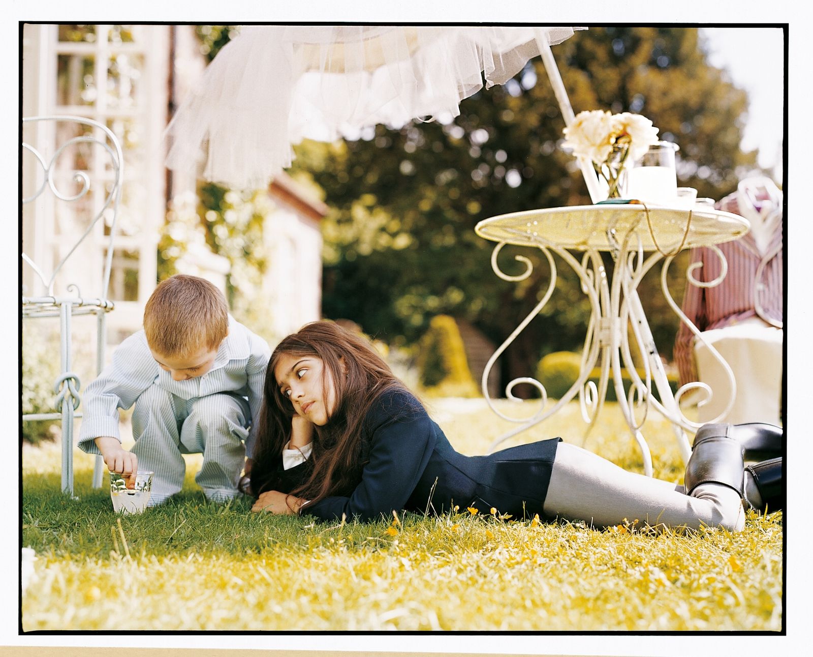 Image may contain Person Teen Head Face Child Grass Plant and People