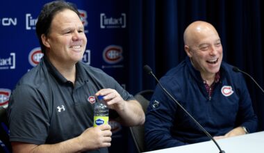 Jeff Gorton, president of hockey operations, left, and GM Kent Hughes laugh while talking to the media.