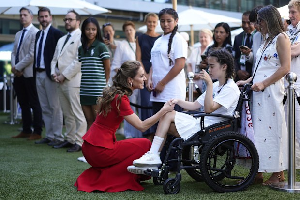 Kate, Princess of Wales speaks with Thea Stach at the Wimbledon tennis championships in London, Saturday, July 11, 2026