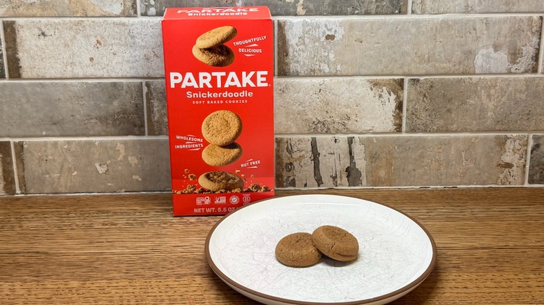 Partake Snickerdoodle Cookies on a plate with a box in the background