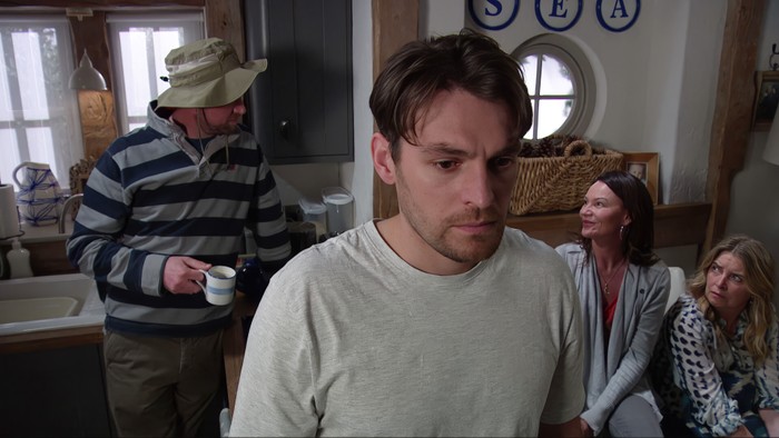 Mack looks worried as Liam, Chas and Charity chat behind him in a scene from Emmerdale Mack looks worried as Liam, Chas and Charity chat behind him in a scene from Emmerdale