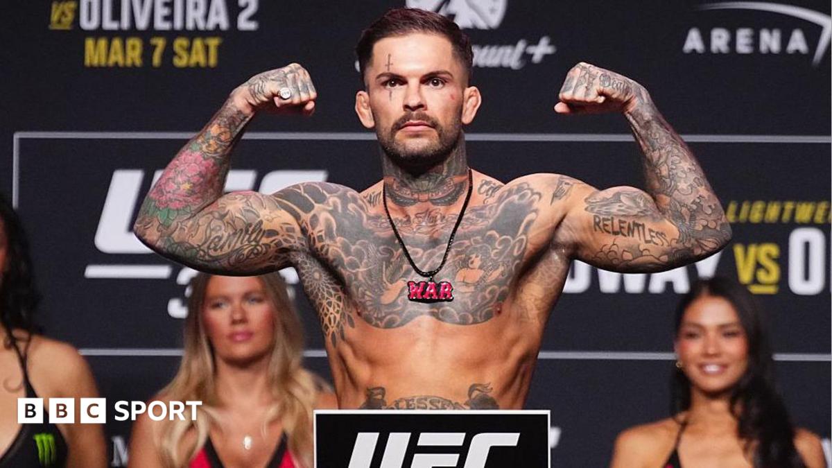 Cody Garbrandt is shirtless and holding up his arms