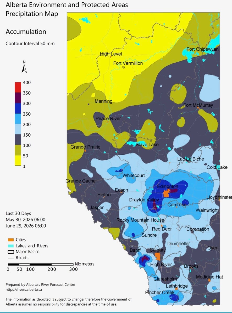A map of Alberta  shows amounts of rainfall over the course of June 2026 with coloured bands of heaviest rain extending outward from Edmonton, the foothills west of Calgary and  south of Lethbridge.