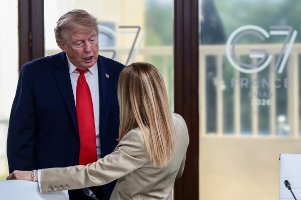 President Donald Trump speaks with Italian Prime Minister Giorgia Meloni at a working lunch with leaders of G7 and the Middle East in Evian-les-Bains, France, Tuesday, June 16, 2026. (Evelyn Hockstein/Pool Photo via AP, File)