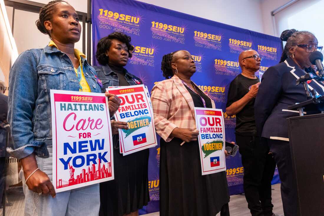 Healthcare workers rally at a Manhattan union headquarters to show support for the Haitian and Syrian communities after the U.S. Supreme Court ruled that the Trump administration could end temporary protected status for potentially millions of foreign nationals from countries experiencing conflict and violence. The decision means that over 330,000 Haitians and Syrians could lose their work authorizations and ability to remain in the country.