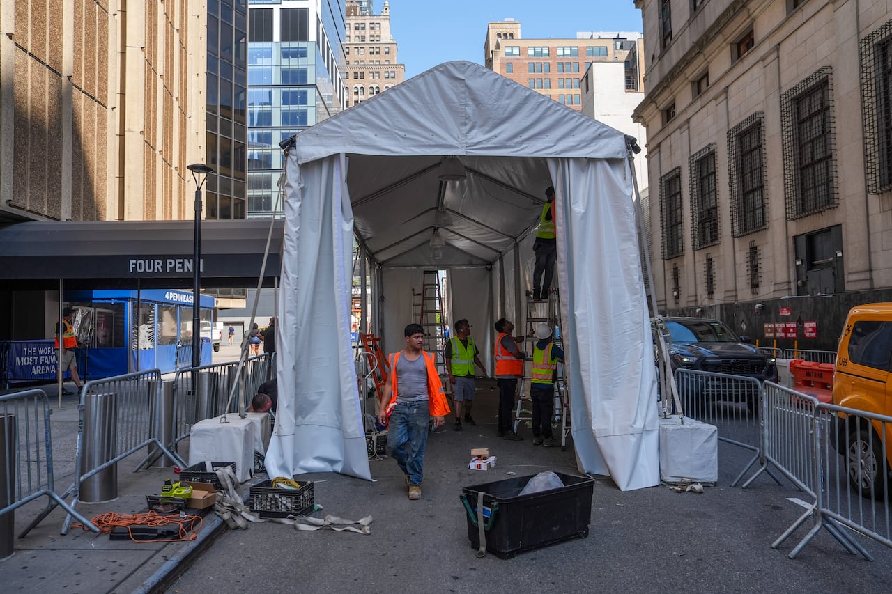 A picture of a tent with workers inside
