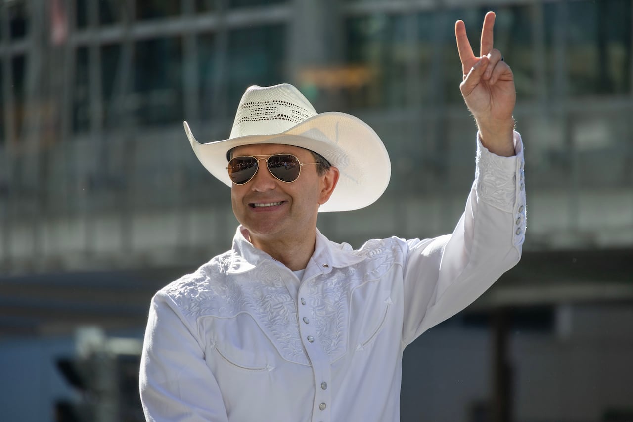 A man in a cowboy hat.