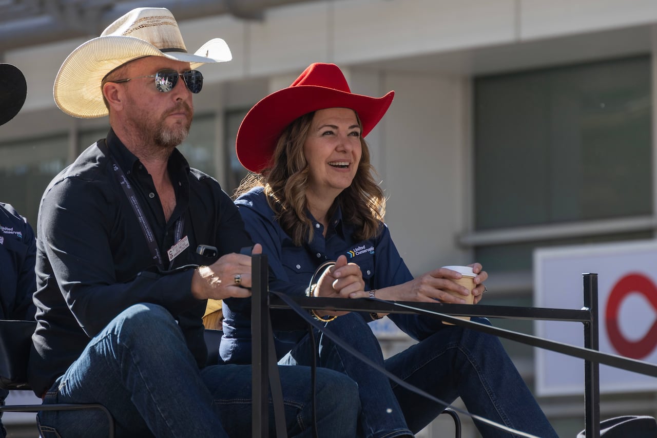 A man and woman in cowboy hats.