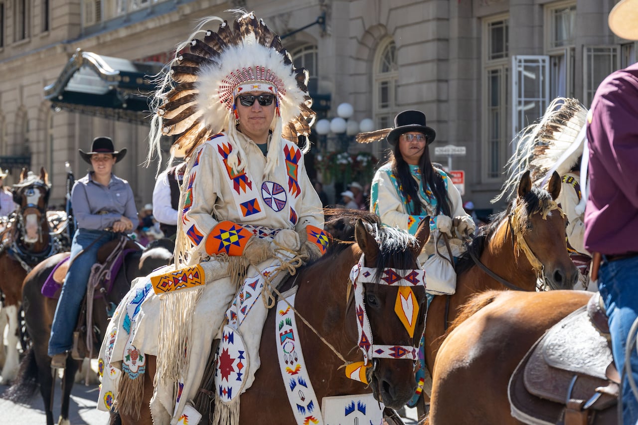People on horseback.