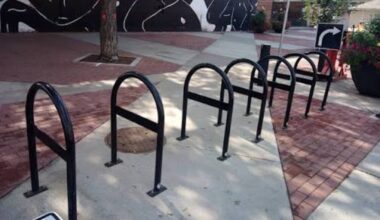 Seven horizontal bike parking spots on a sidewalk
