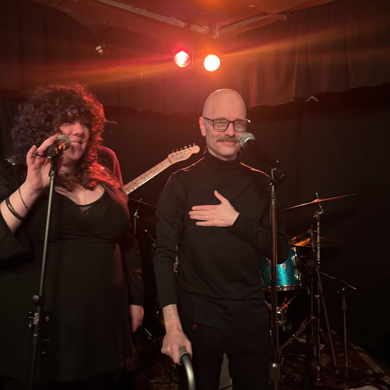 A man and a woman on a stage.