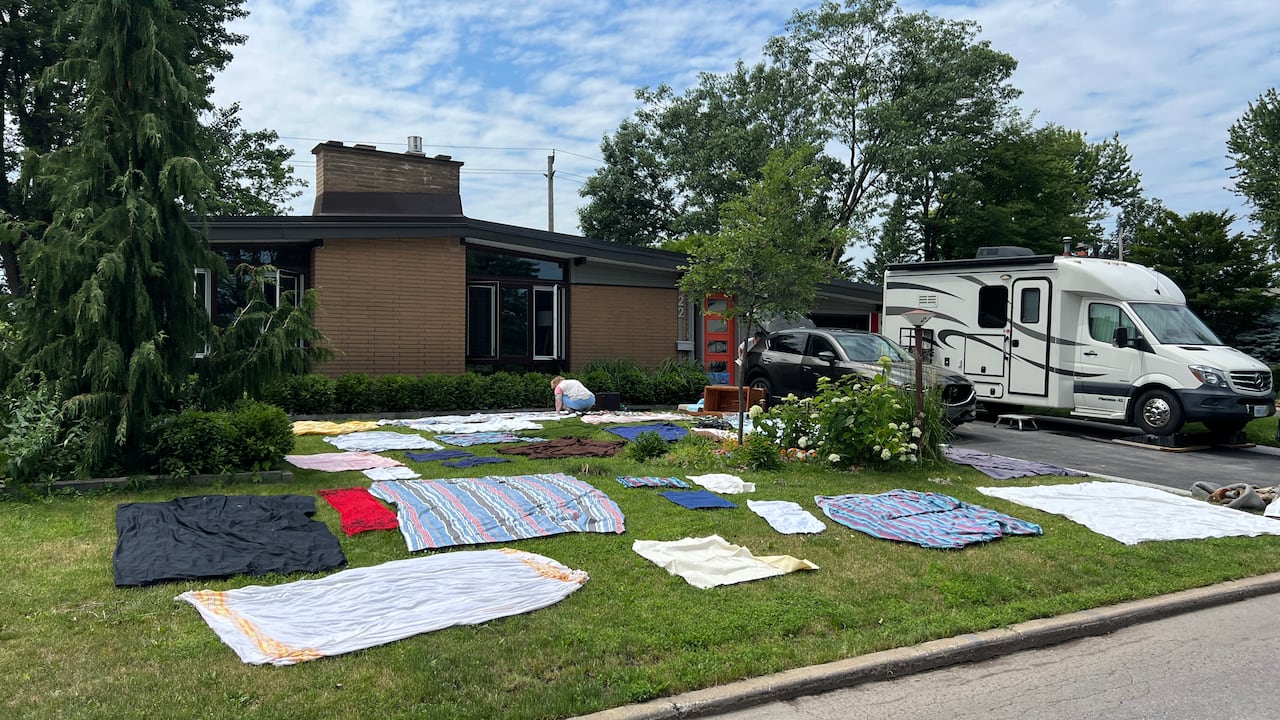 Bedding sits dries out on a lawn.