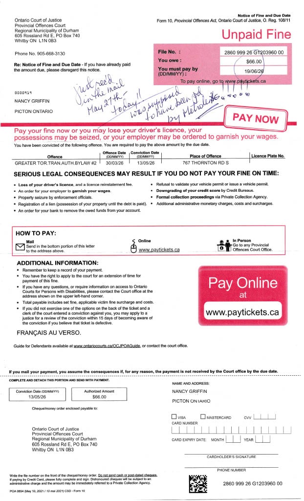 A photo of a parking ticket with a 66 dollar conviction notice.