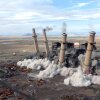 Smokestacks at the San Juan Generating station in New Mexico fall in an explosive demolition on Aug. 24.