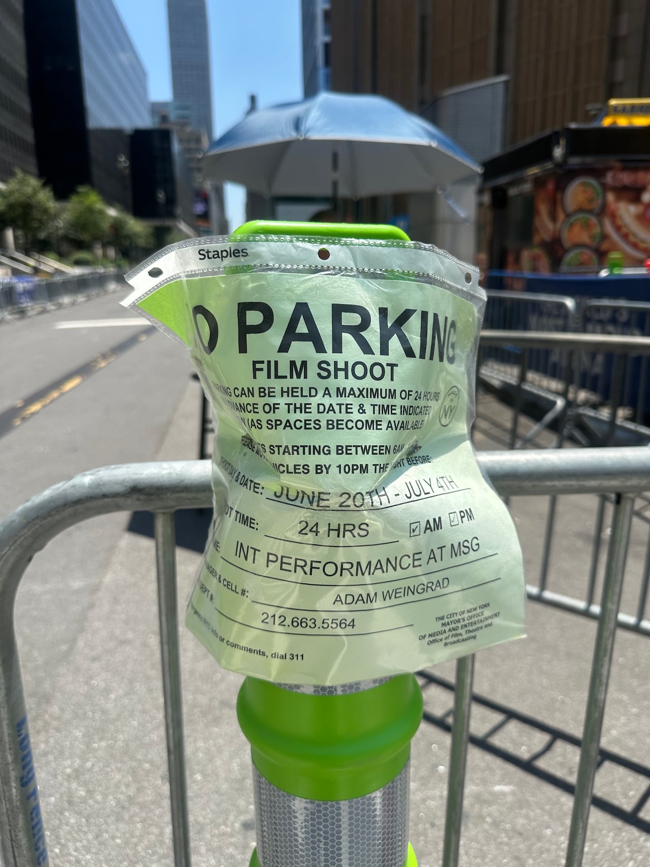 Signs indicating a “film shoot” between June 20th and July 4th of a “performance at MSG” displayed on barricades