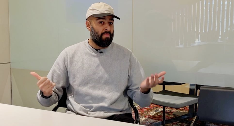 Alkarim Devani is sitting in a boardroom. He's the co-founder of RNDSQR, an inner-city builder.