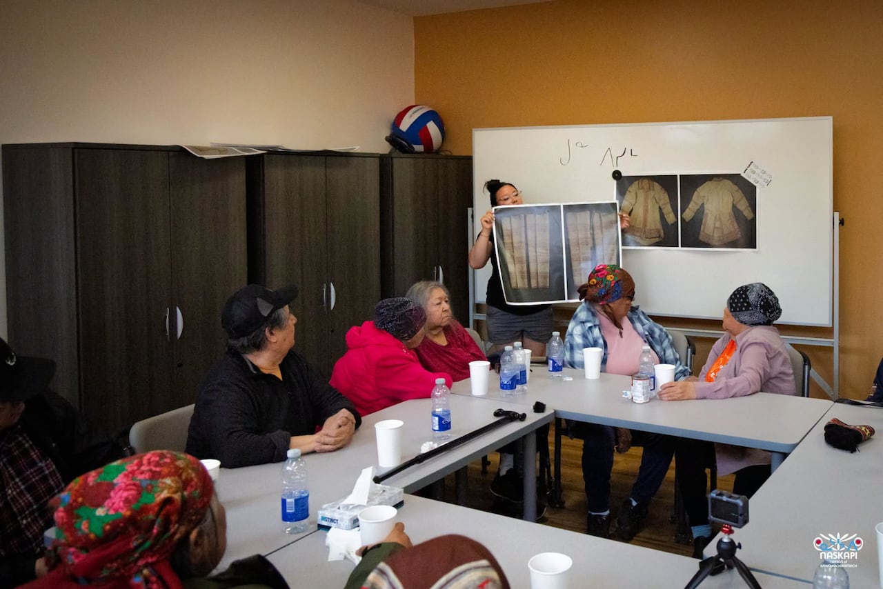 A group of people sitting at tables