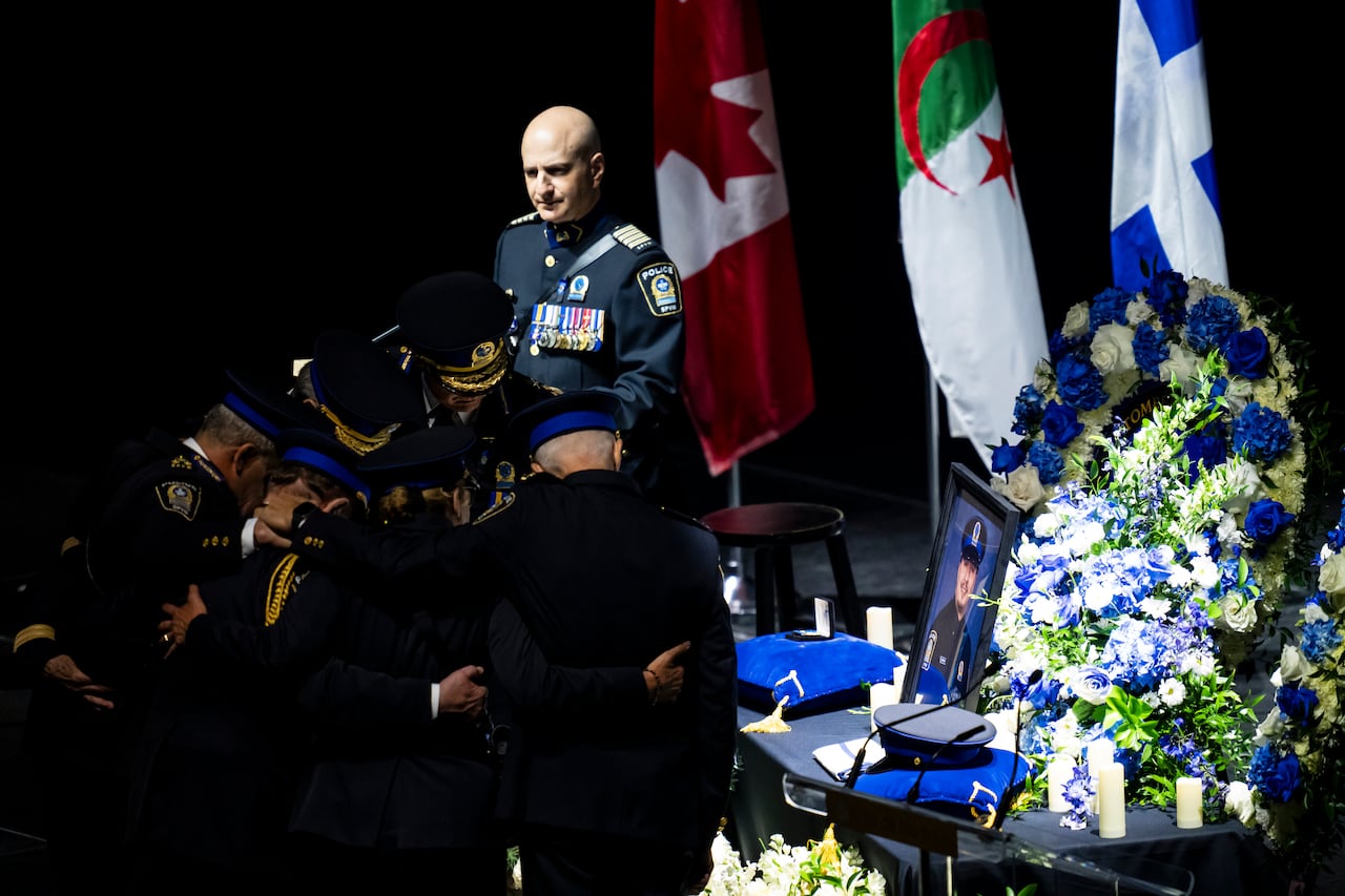 SPVM Chief Inspector David Shane looks on as officers pay their respects to Benredouane.