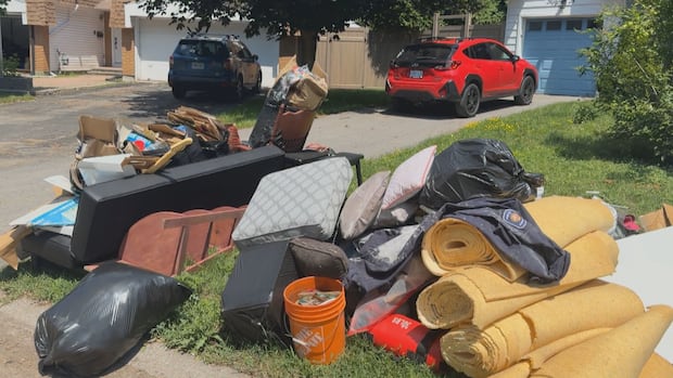 'Don't take that. It's contaminated,' post-storm scavengers warned