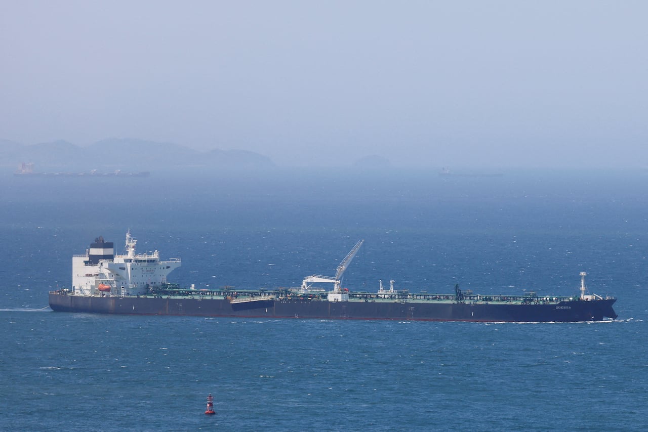 A cargo ship sails on the water.