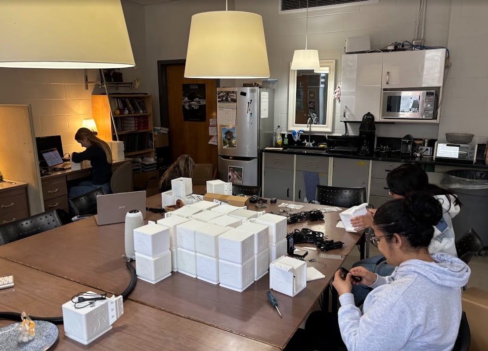 Undergraduate students at the University of Windsor prepare and make alterations to acoustic boxes used in the field to capture nocturnal bird sounds at night. 100 of the devices have been installed across Canada.