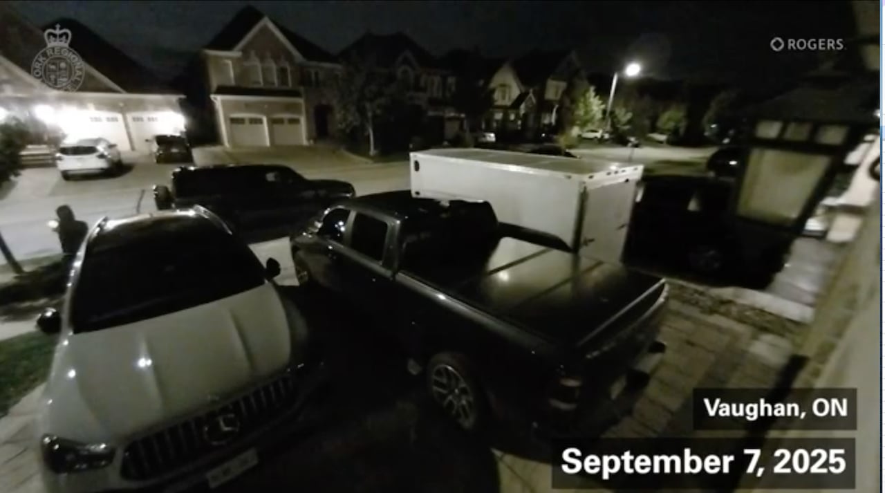 Still from security footage showing a shooting at a house.