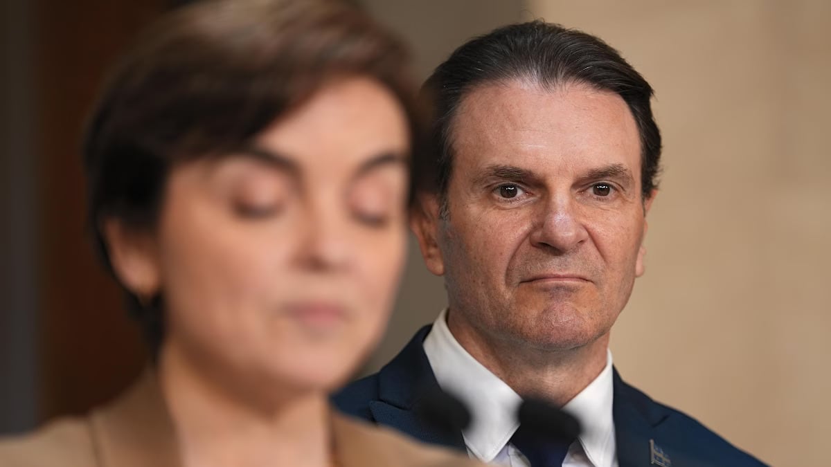 Quebec Immigration Minister François Bonnardel stands behind Quebec premier Christine Fréchette