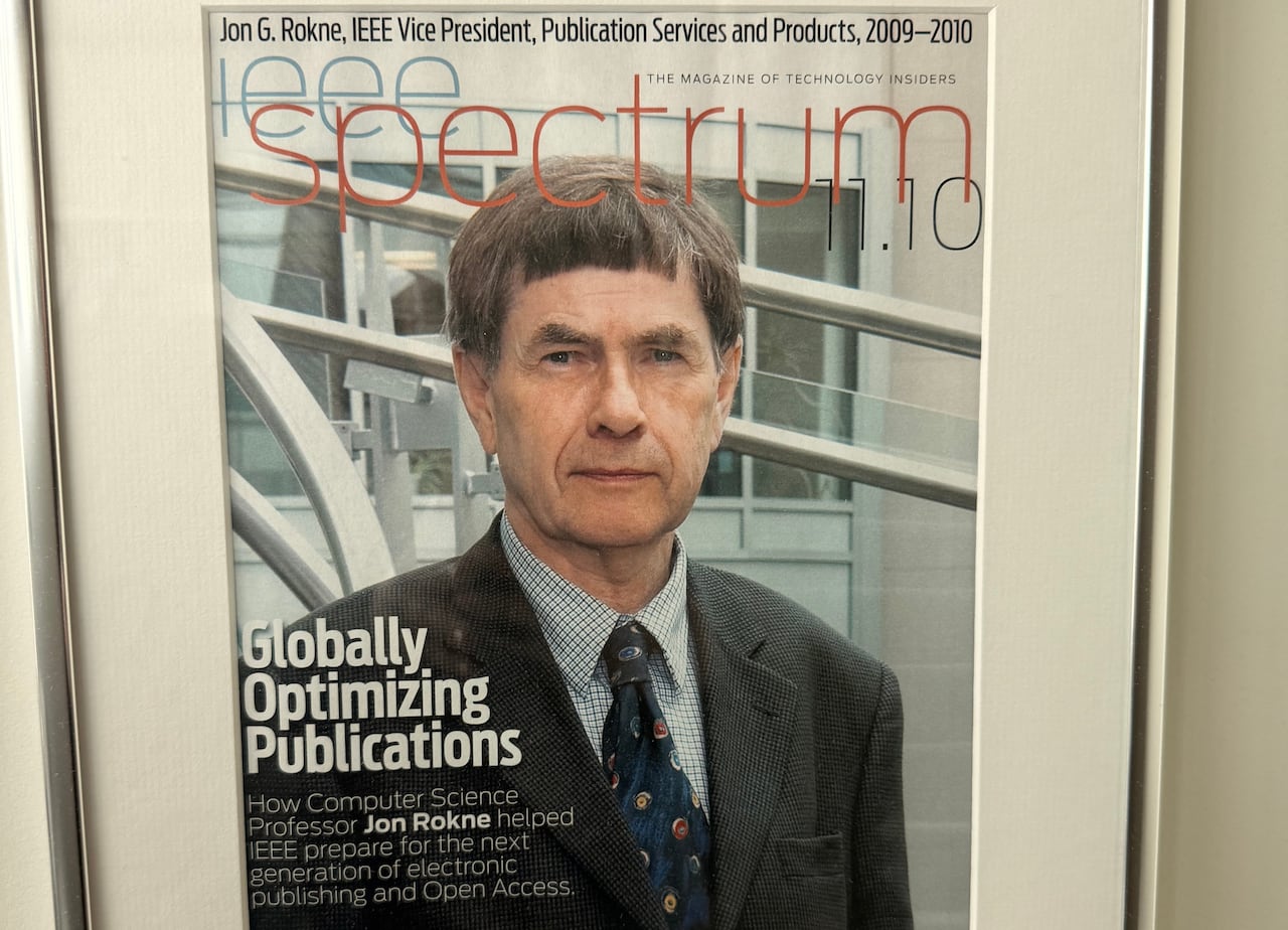 The front page of a magazine published by the IEEE features a photo of Jon Rokne.