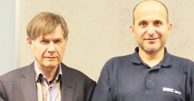 Two men standing side-by-side