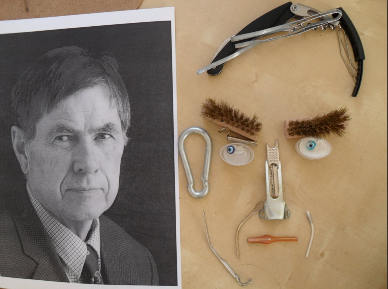 A man in a suit on the left and on the right is a portrait of the same man using household items like a wine bottle opener and scrub brushes.