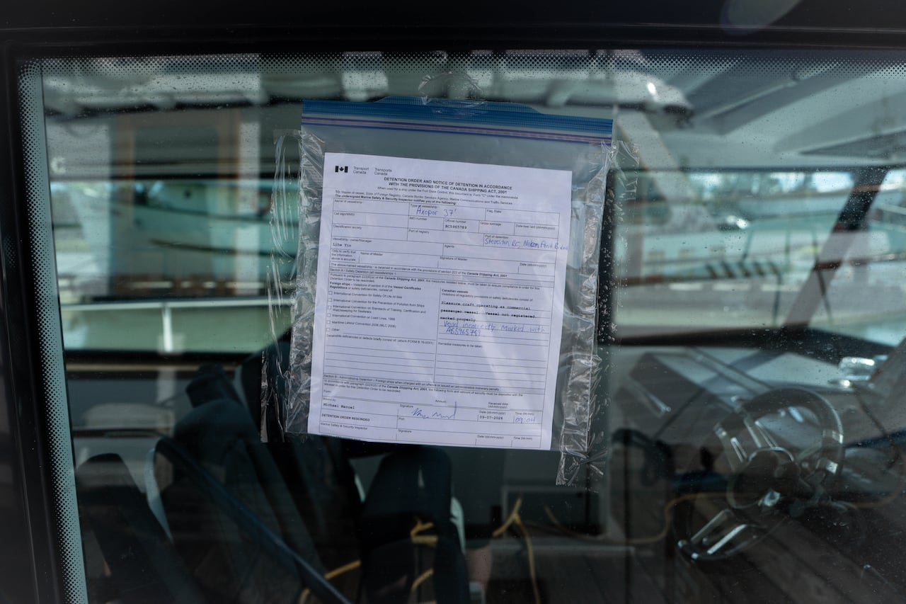 A detention order is pasted on a boat window