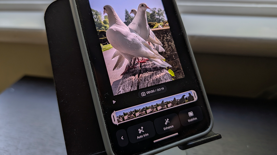 Smartphone displaying the Google Photos video editor with Auto trim button.