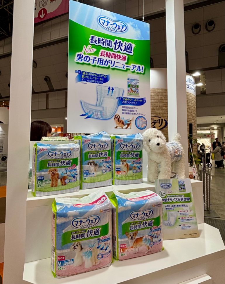 Dogs pose in well-decorated pet carts at the Interpets Conference at the Tokyo Big Sight Conference Centre on April 5, 2026." For the second two, they are both from the Unicharm stand at the Interpets conference, but I took those on April 3, 2026. Same location.