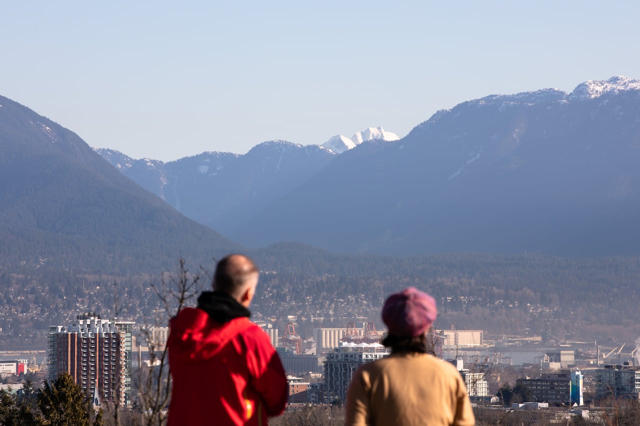 People look at the view from Queen Elizabeth Park in Vancouver on March 18, 2020.
