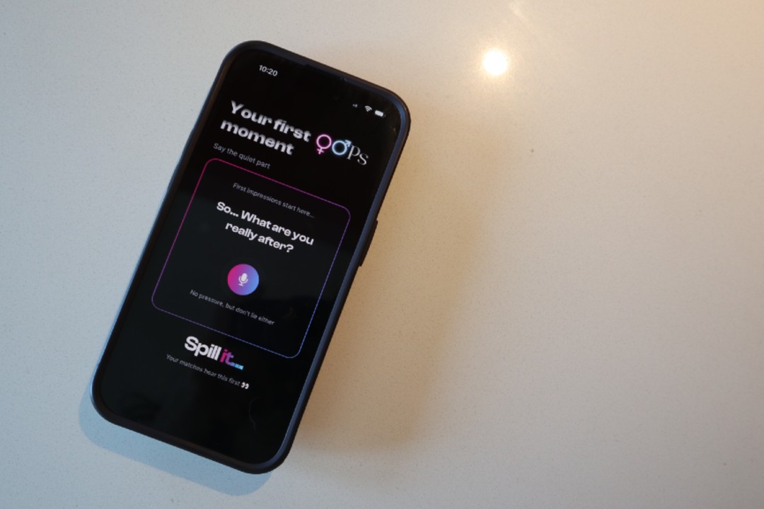A phone displaying the opening screen of Oops Social