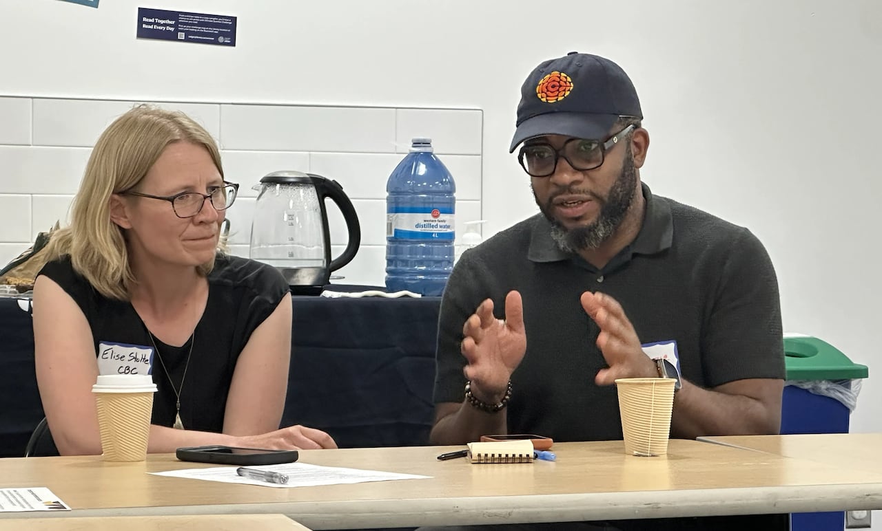 Two people seated at a table.
