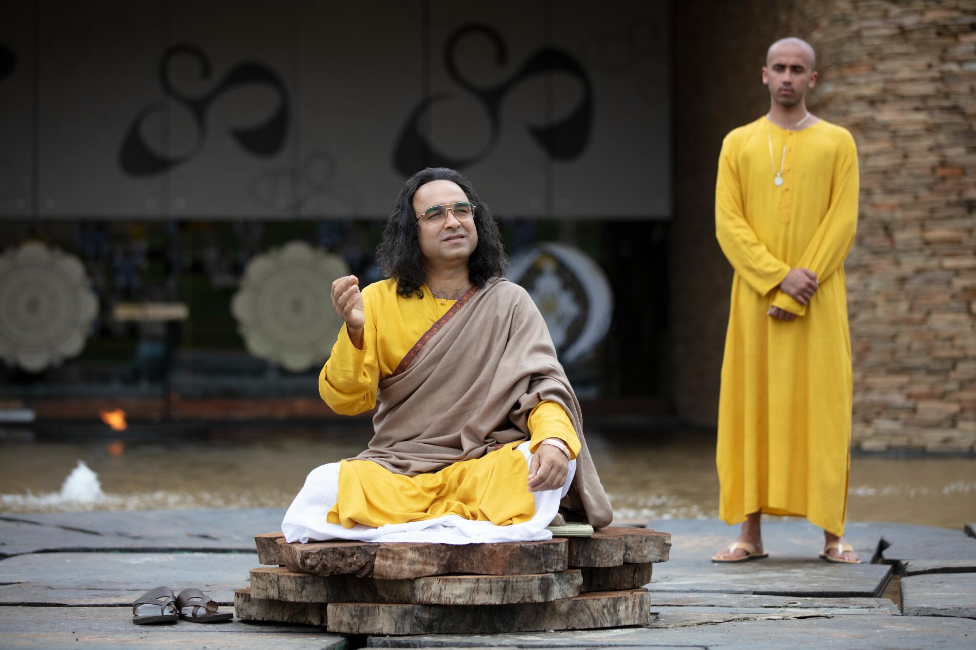 A guru sits cross-legged in "Sacred Games."