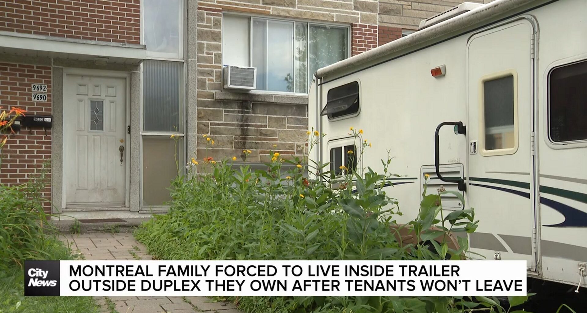 Montreal family forced to live in trailer outside duplex they own