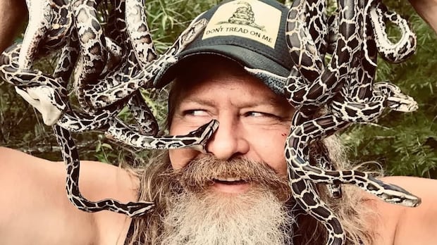 A dead python will get you a free pizza at this man's restaurant. Yes, it's in Florida