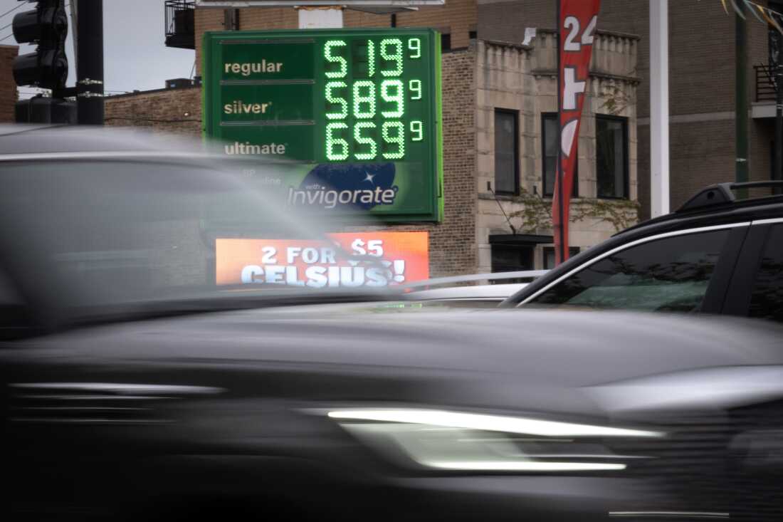Cars and oil prices at a U.S. gas station