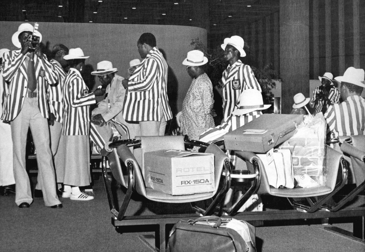 Members of the Nigerian Olympic team prepare for their journey home at Montreal's Mirabel Airport July 16, 1976 after it was announced they would boycott the Olympic Games.